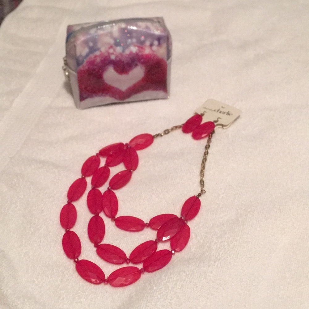 Charming Charlie jewelry set with makeup case